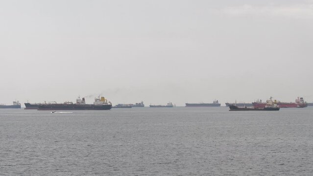 Marine panorama of the modern Bosphorus Strait. Dry cargo ships on the roads in the waters of the port of Istanbul