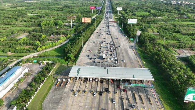 Aerial view of busy toll road with many cars queuing up to pay the highway toll on Road No. 5B connecting Hanoi to Hai Phong city.