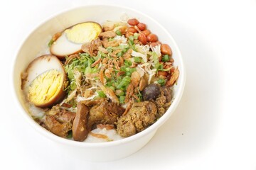 Special Bandung chicken porridge traditional Indonesian food consisting of white rice porridge.