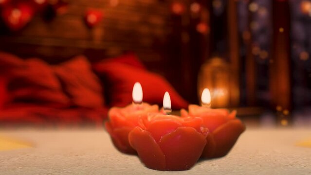 A slow glide revealing a rose shaped candle, cozy and romantic cabin interior illuminated by the warm glow of candles and heart-shaped balloons, creating a Valentine's Day celebration.
