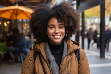 Close up portrait happy wide toothy smiling African American young ethnic woman girl female student tourist traveler successful businesswoman city street cafe outside holidays weekend travelling tour - obrazy, fototapety, plakaty