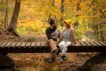 Fototapeta premium couple of man and woman talking, hugging, looking at each other,