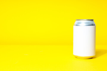 Tin can for drinks on a yellow background