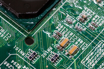 wet digital circuit board with microprocessors and components, closeup full-frame macro background