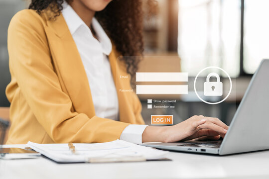 Businessman typing login and password in the concept of cyber security, information security, data protection, and encryption for secure access to user's personal information.