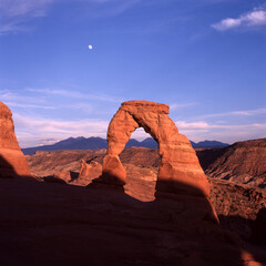 Delicate Arch, blue sky and moon