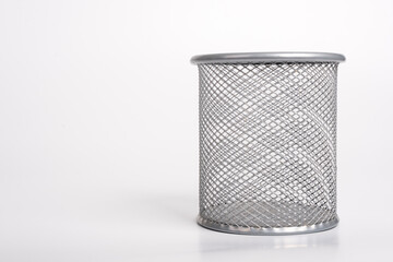 Gray metal pen holder isolated on white background. Empty basket paper, waste bin. Cup for pens, copy space