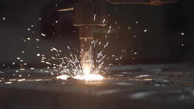 Close Up. Spindle`s Tip laser. Welding Steel Workpiece With Bright Sparks. High Temperatures. Automated Machine. Production Process. Industrial Plant. Metal Materials. Slow Motion. Heavy Duty.