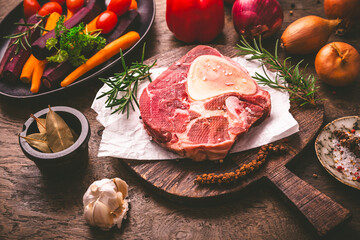 Raw beef meat shank steak, with  ingredients for preparation of ossobuco