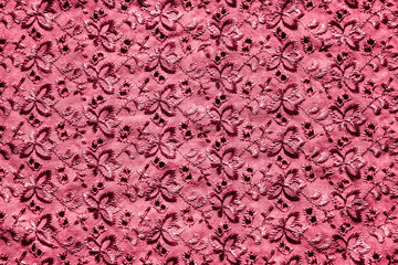 satin stitch embroidery. texture of red cotton fabric with floral pattern