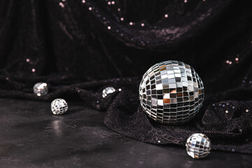  Beautiful disco balls on a black background. Modern postcard with space for text