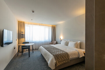 Interior of a luxury master bed hotel bedroom