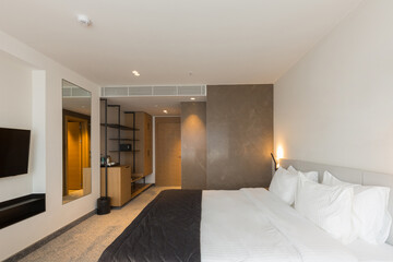 Interior of a luxury master bed hotel bedroom