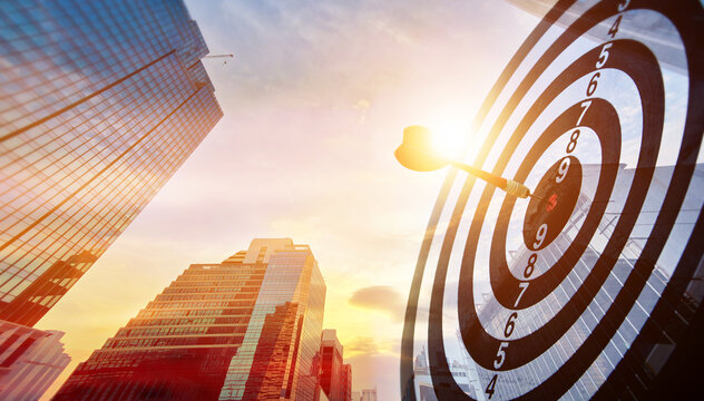 Business background with cityscape, business district buildings, and target board. Concept of Setting Business Goals and symbol represents the work and vision of organization with a common goal.