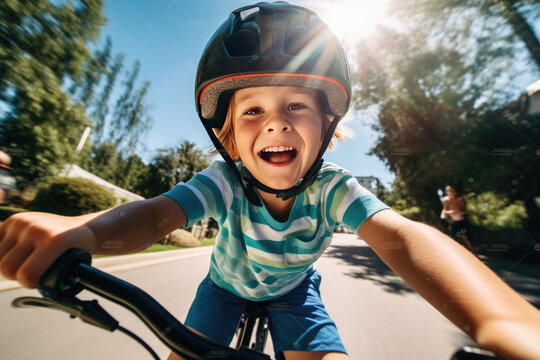 Cheerful kid riding a bicycle on a summer day