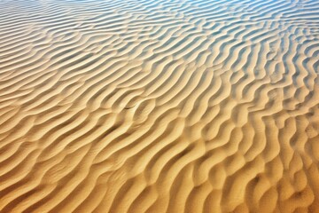 Fototapeta premium sand with a wave pattern under clear blue sky