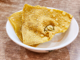 crispy dumplings in white plate