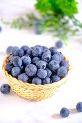 group of organic blueberry in basket