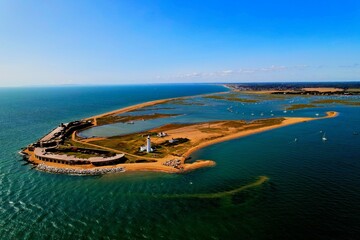 Aerial view of an idyllic tropical island with blue waters in Hurst Spit, UK