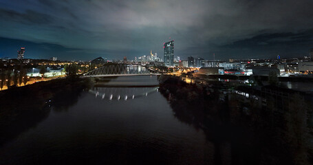 Naklejka na ściany i meble View of the ECB in Frankfurt and the Skyline at night Aerial