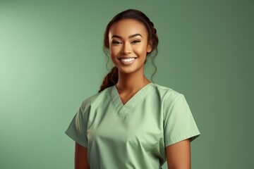 Attractive woman wearing medical scrubs, isolated on green background. Place holder, copy space banner, Female Nurse, Medical Professional