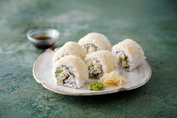 Homemade sushi rolls with crab meat and avocado