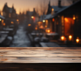 Christmas background. Empty wooden table on the background of Christmas wooden housesy . Ready for product montage.