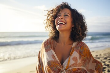 Happy mature latin woman at the beach - Powered by Adobe