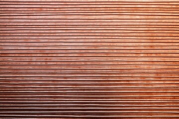 a flat view of a copper sheet with long grooves