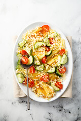 Couscous salad with grilled cheese and vegetables