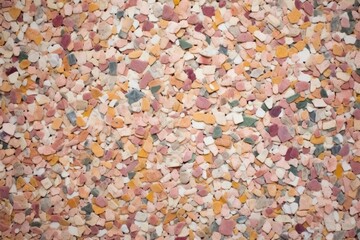 surface of faded sun-bleached terrazzo floor with a mixture of subtle color chips