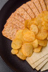 Crispy potato chips with salt, spices and herbs