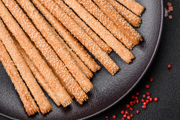 Delicious fresh grissini sticks with salt and sesame seeds