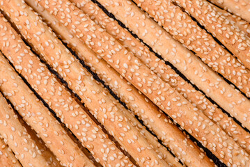 Delicious fresh grissini sticks with salt and sesame seeds