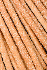 Delicious fresh grissini sticks with salt and sesame seeds