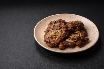 Delicious fried chicken or beef liver with salt, spices and herbs