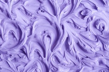 Purple clay (alginate face mask, body wrap, hair shampoo, conditioner) texture close up, selective focus. Abstract lavender background with swirl brush strokes.