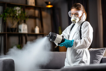 A woman in uniform sanitizes the space, ensuring cleanliness and hygiene