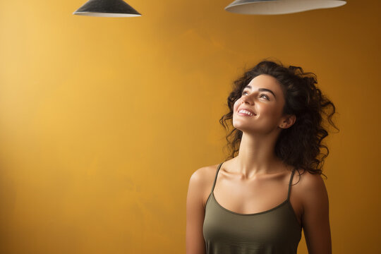 Smile in Contemplation: Joyful Young Woman Poses in Studio, Lost in Thought