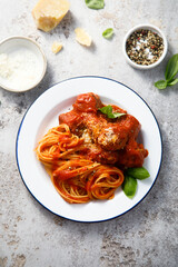 Spaghetti with meatballs and Parmesan cheese