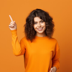 Photo of young woman happy positive smile point finger empty space billboard ad advice choice isolated over orange color background, ai technology