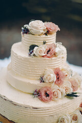 wedding cake decorated with roses