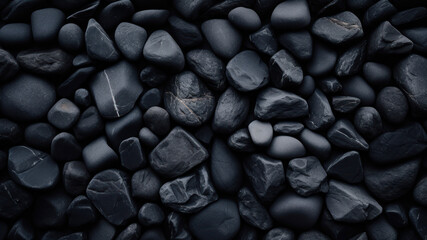 Pebbles background. Black pebble stones background texture.