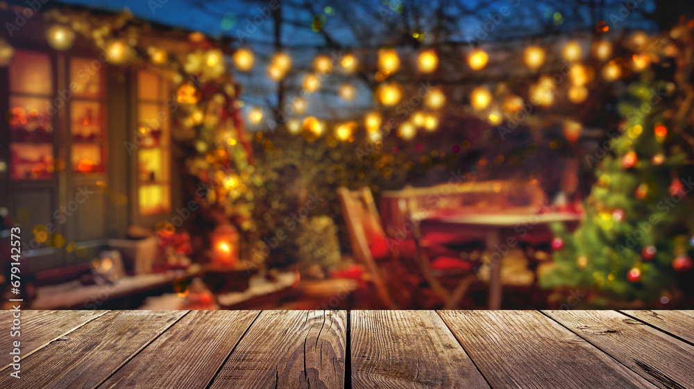 Wall mural wooden table and winter christmas party in backyard garden with grill bbq, blurred background