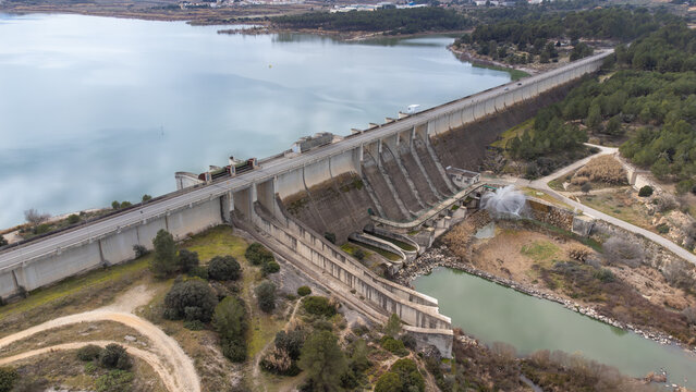 Drone view of the gravity dam for irrigation and water containment and reservoir lake in Bellus, in the province of Valencia, Spain