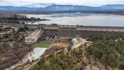 Front view of a gravity dam for irrigation and water containment and the relief channel at Bellus,...