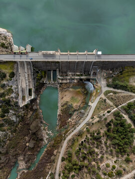 Wall of a gravity dam from above dedicated to irrigation and water containment and spillway channel in Bellus, in the province of Valencia, Spain