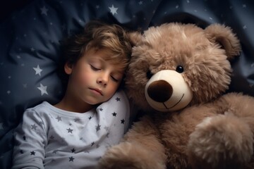 child with teddy bear in bed