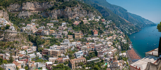 A trip to the Amalfi Coast on a summer's day, blue sky. View of the idyllic houses on the cliff....
