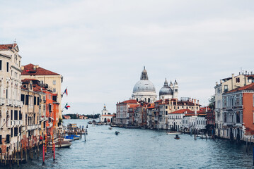 Famous view of Venice Grand Canal with Saint Mary of Health dome on sunny day from Ponte...